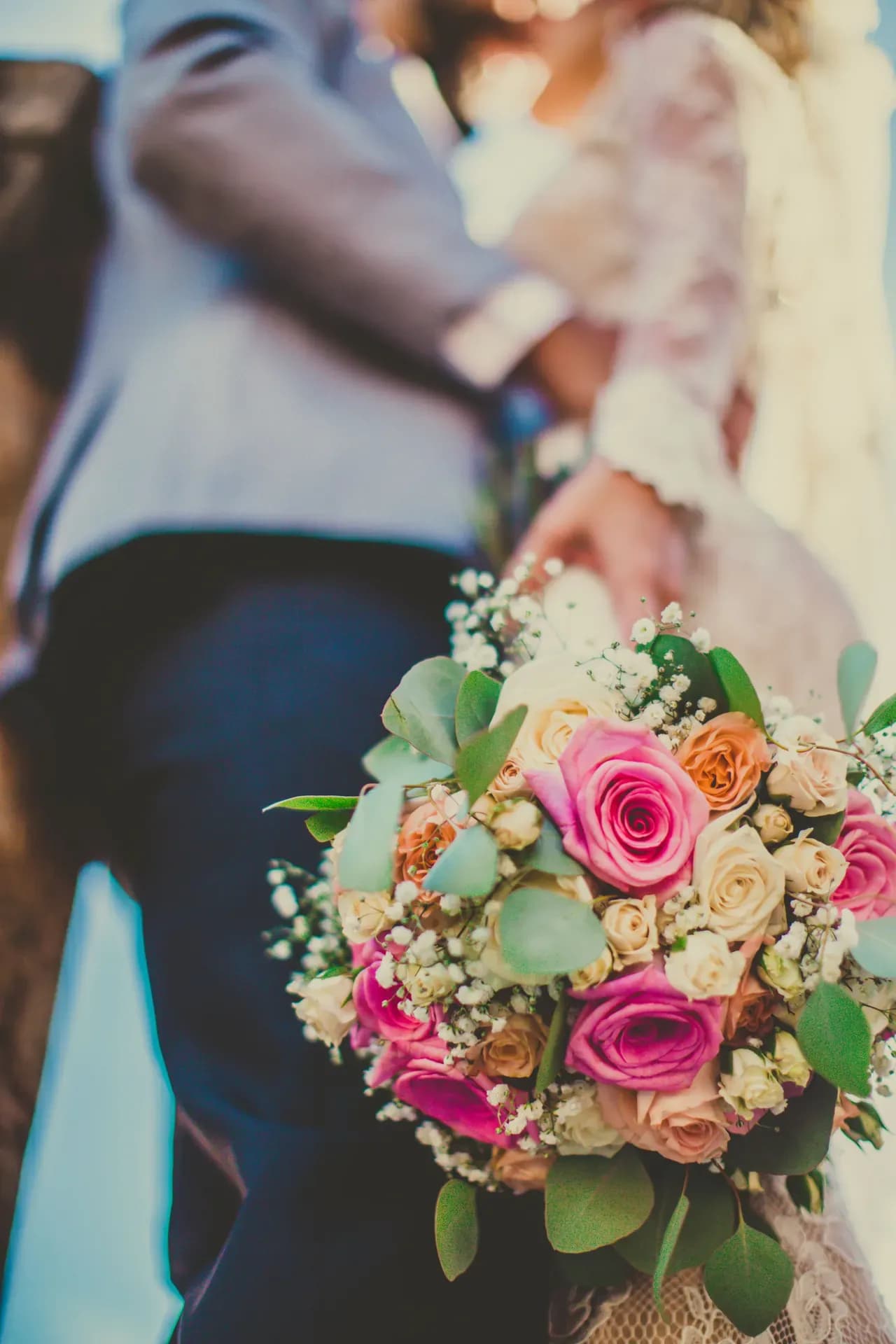 Newlyweds celebrating outdoors with their guests